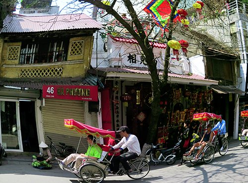 Foreigners travel Ha Noi Old Quarter. Photo: Hoang Minh